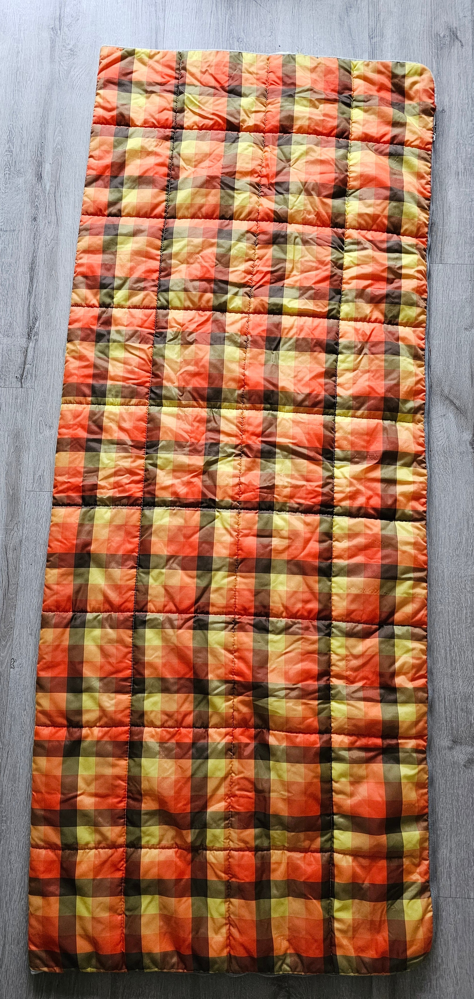 Geruite slaapzak oranje
