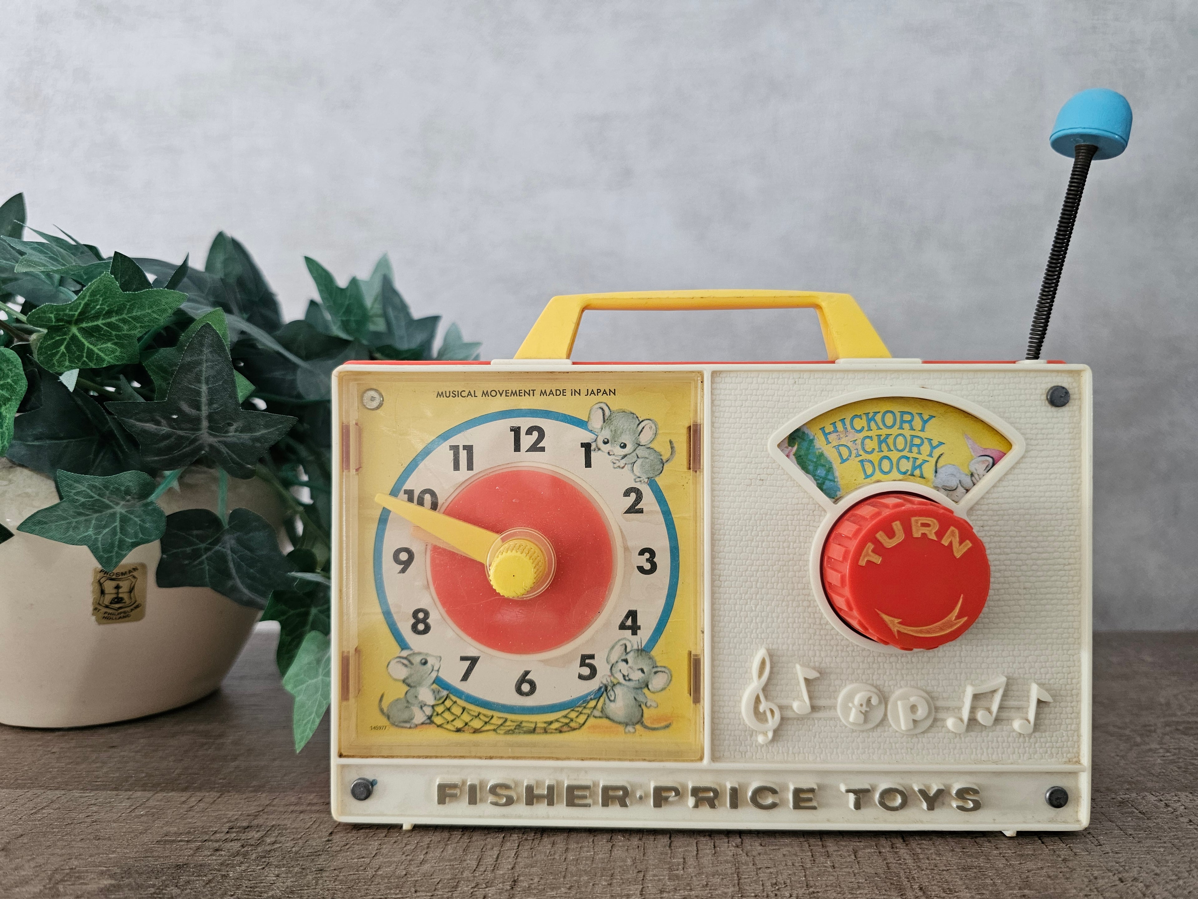 Fisher price vintage muziekdoosje met klok