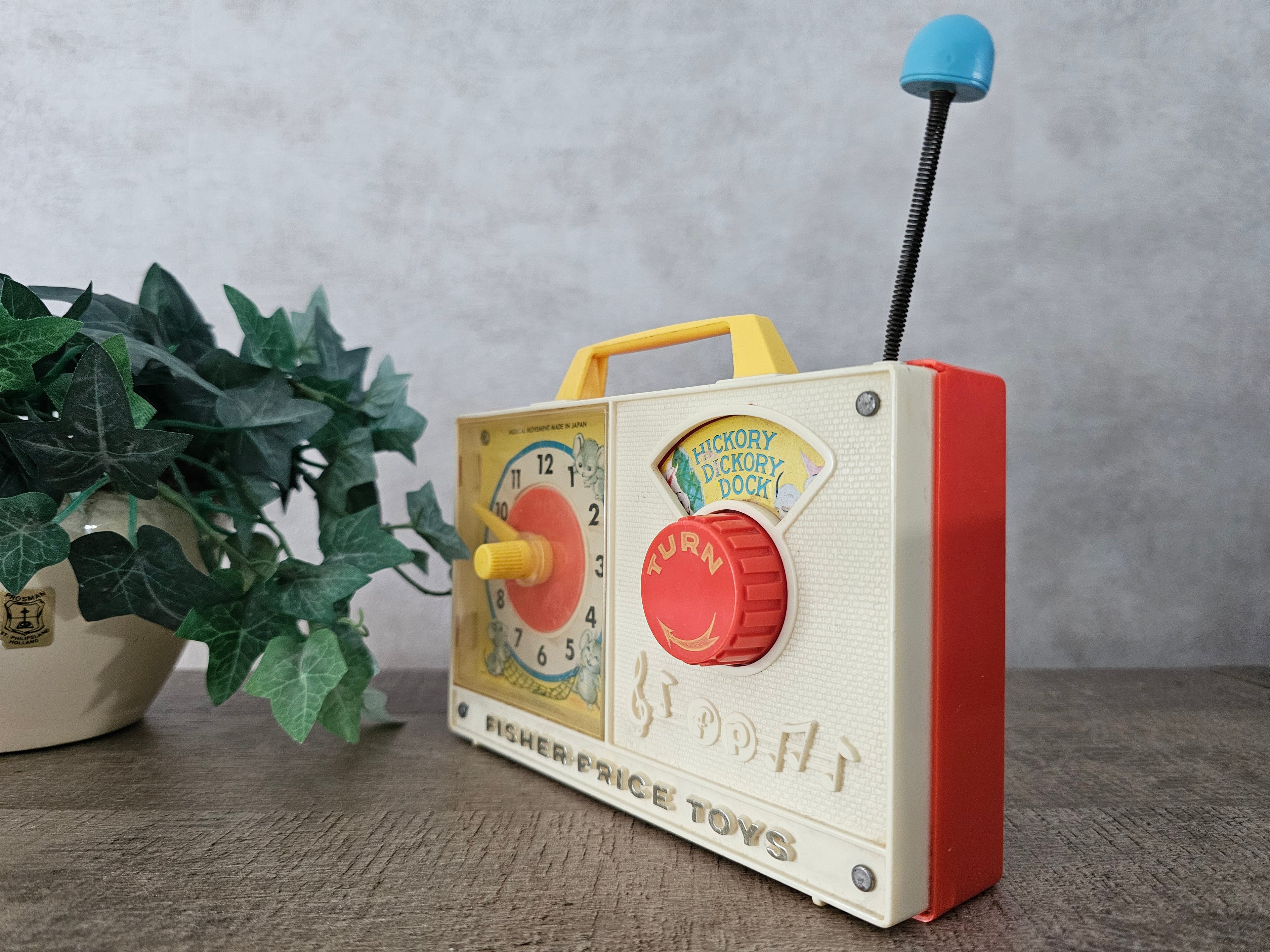 Fisher price vintage muziekdoosje met klok