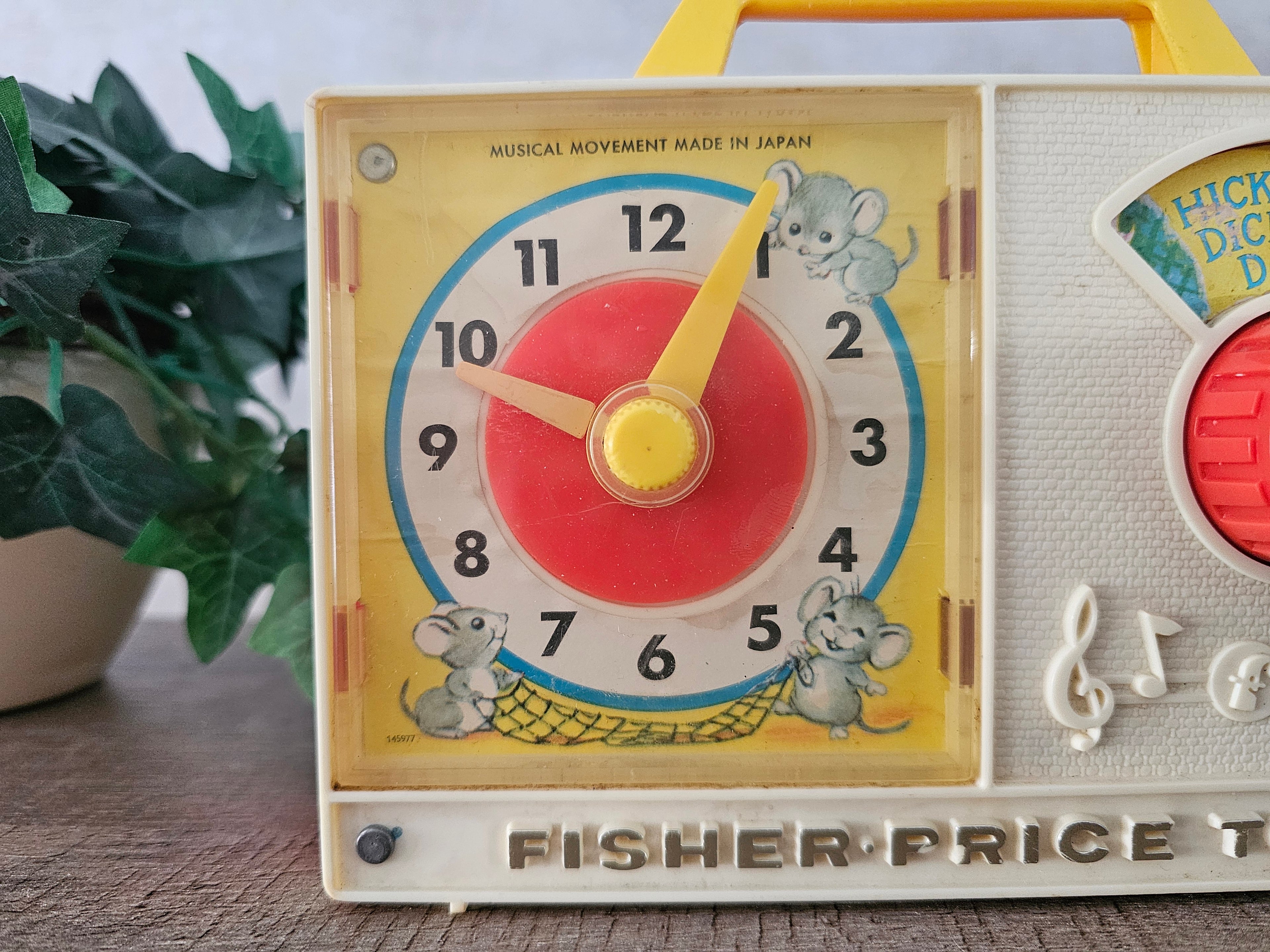 Fisher price vintage muziekdoosje met klok