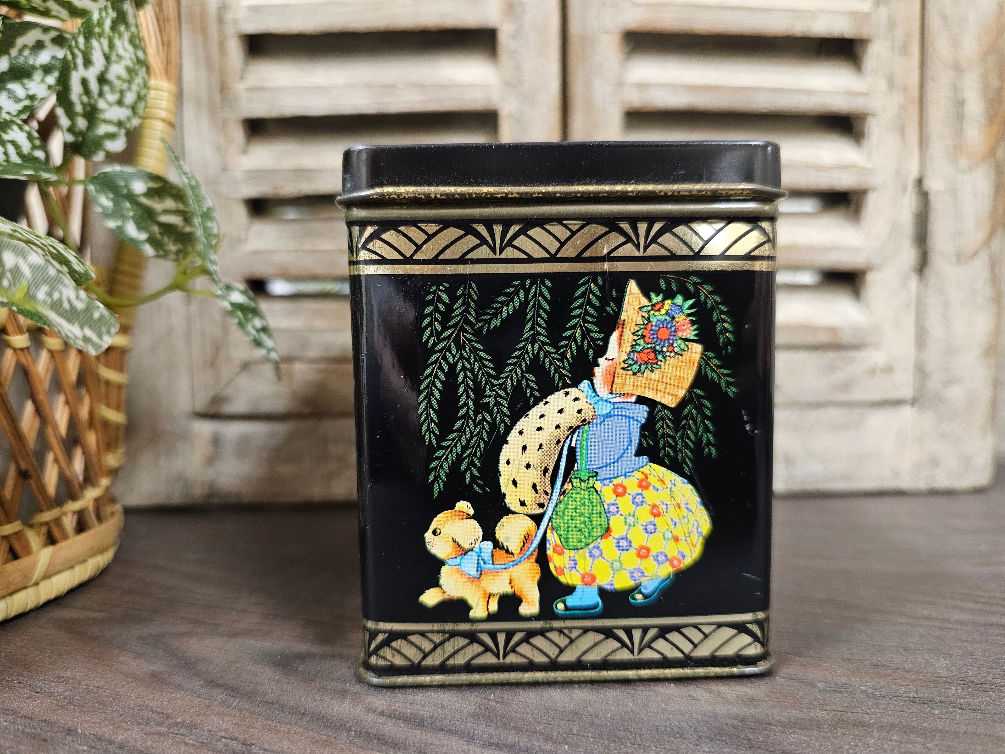 Vintage zwart blikje met meisje