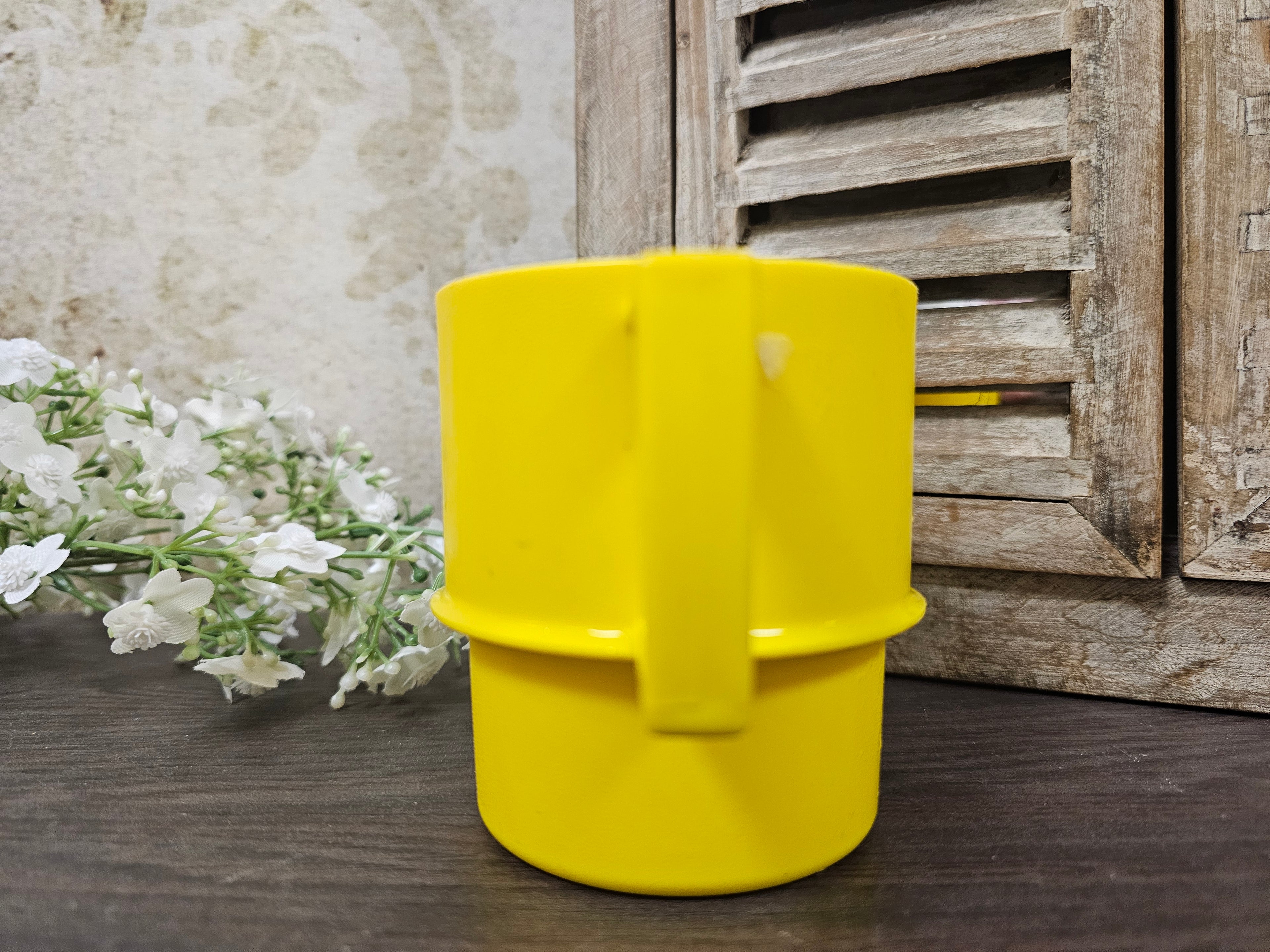 Tupperware gele koffie beker