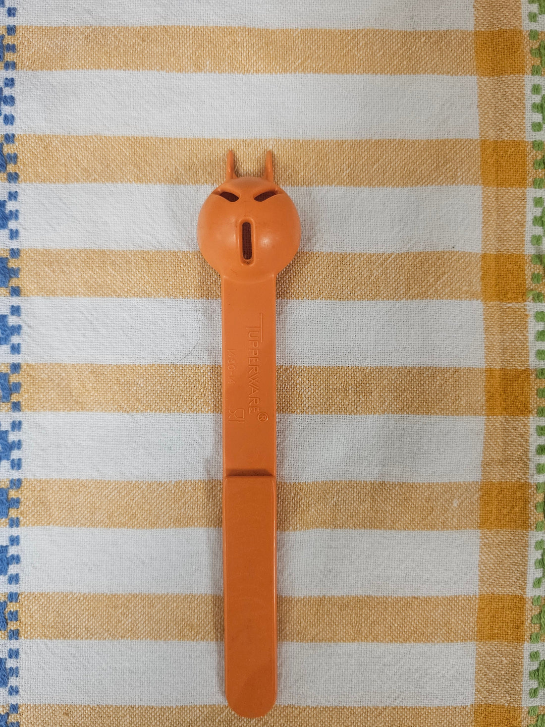 Tupperware oranje zuurkatje lepel