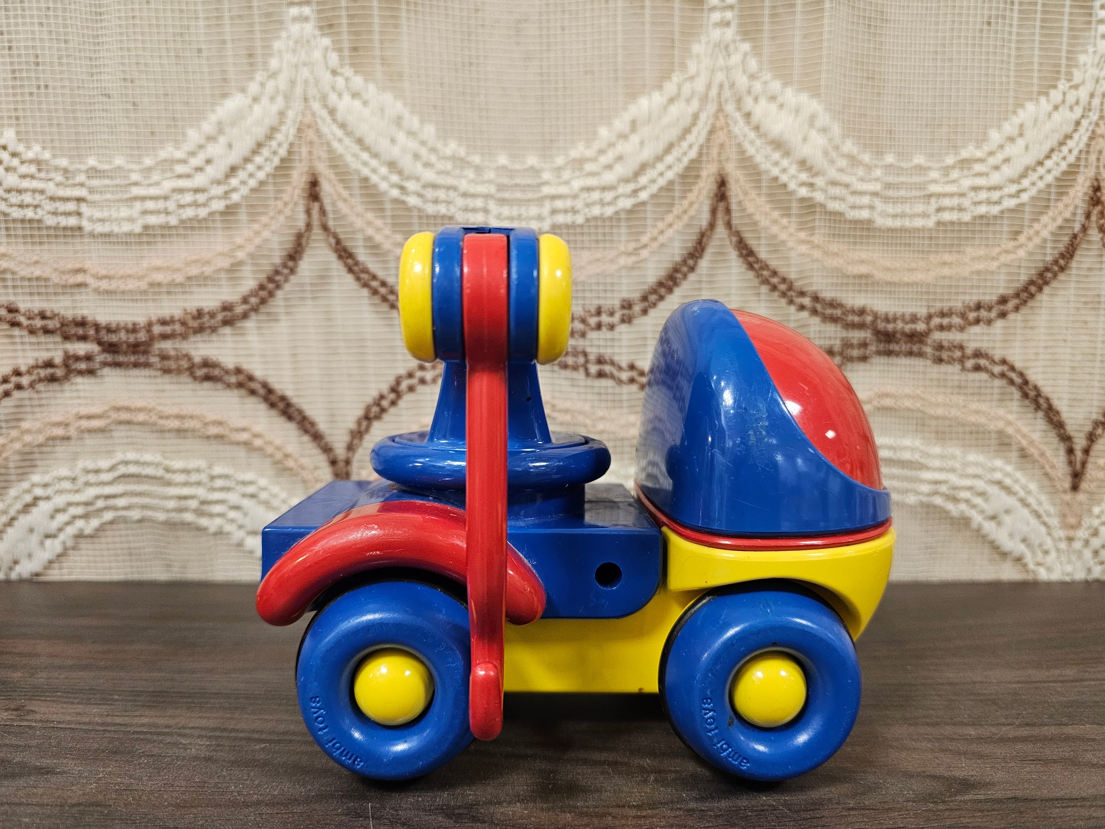 Vintage Ambi Toys takelwagen rood/blauw/geel met haak
