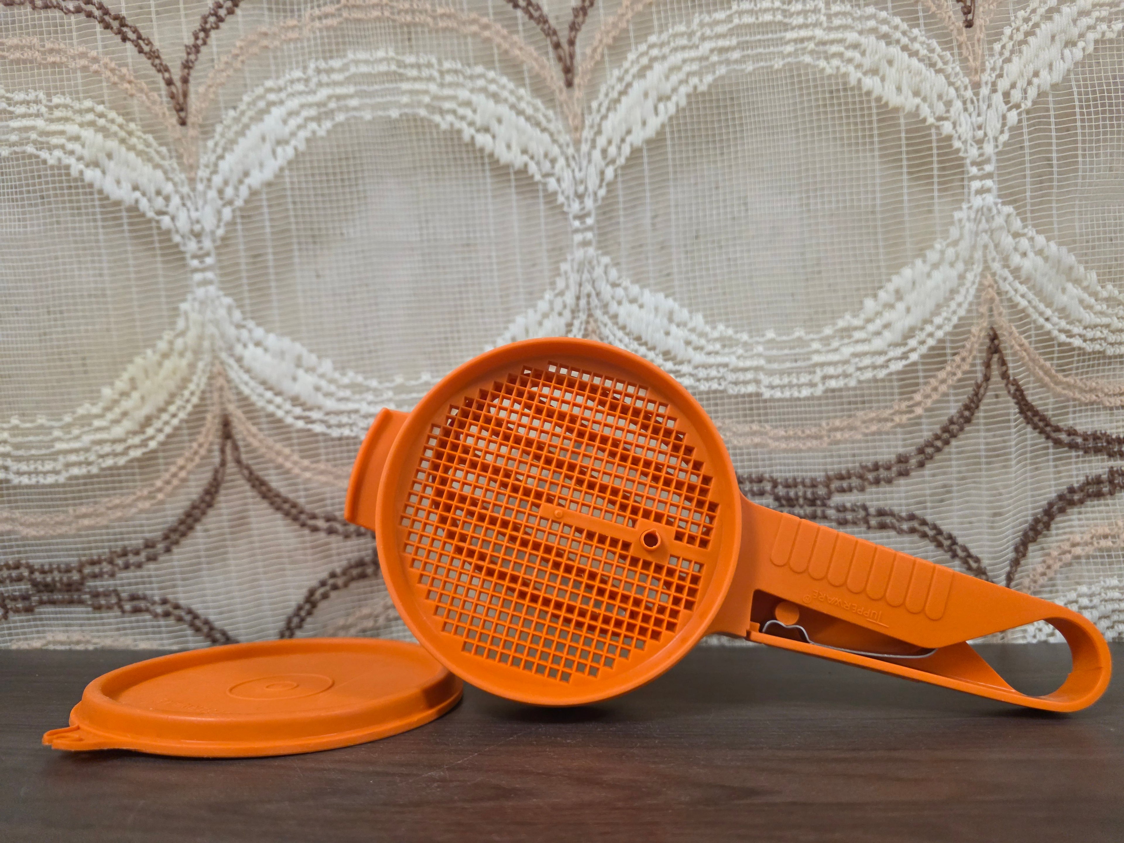 Vintage Tupperware bloemzeef handzeef oranje