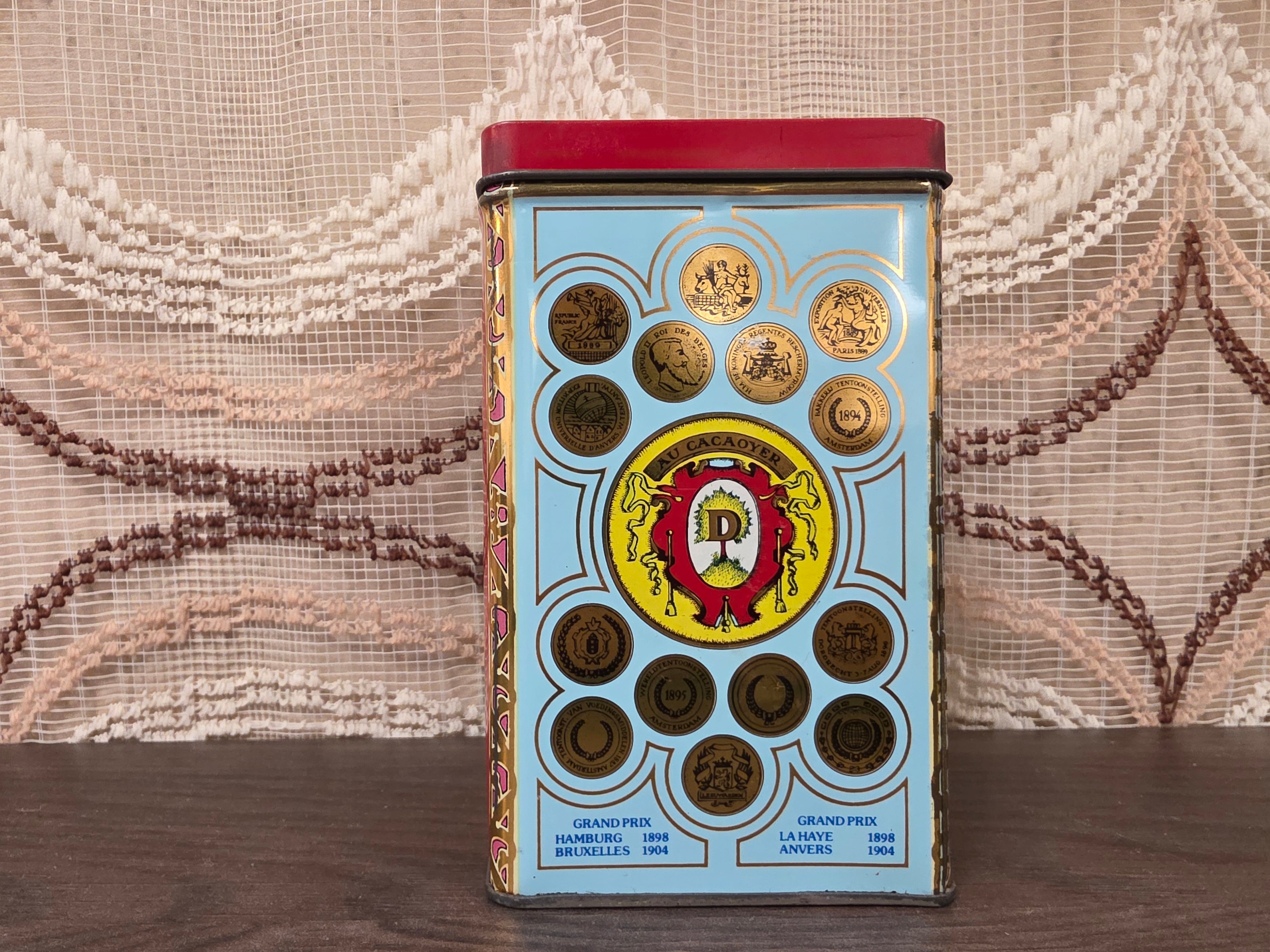 Vintage Droste cacao blik met vier verschillende afbeeldingen