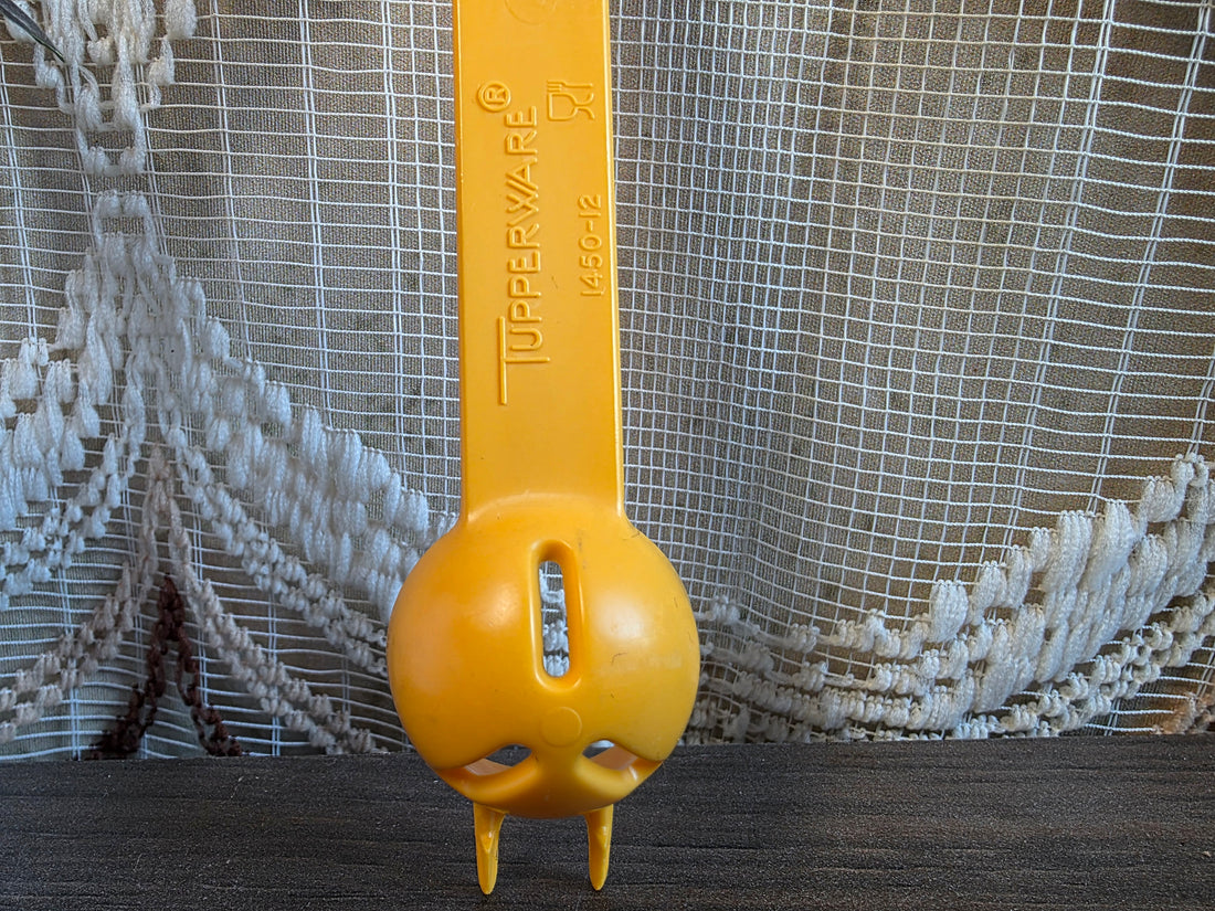 Tupperware oranje zuurkatje lepel