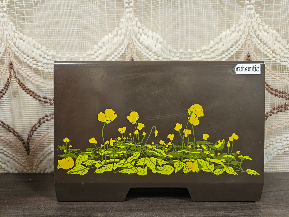 Brabantia Boterbloem koffiefilterhouder van bruin metaal met gele bloemenprint