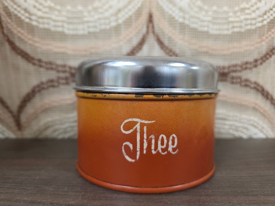 Vintage Brabantia theeblik oranje met zilverkleurige deksel