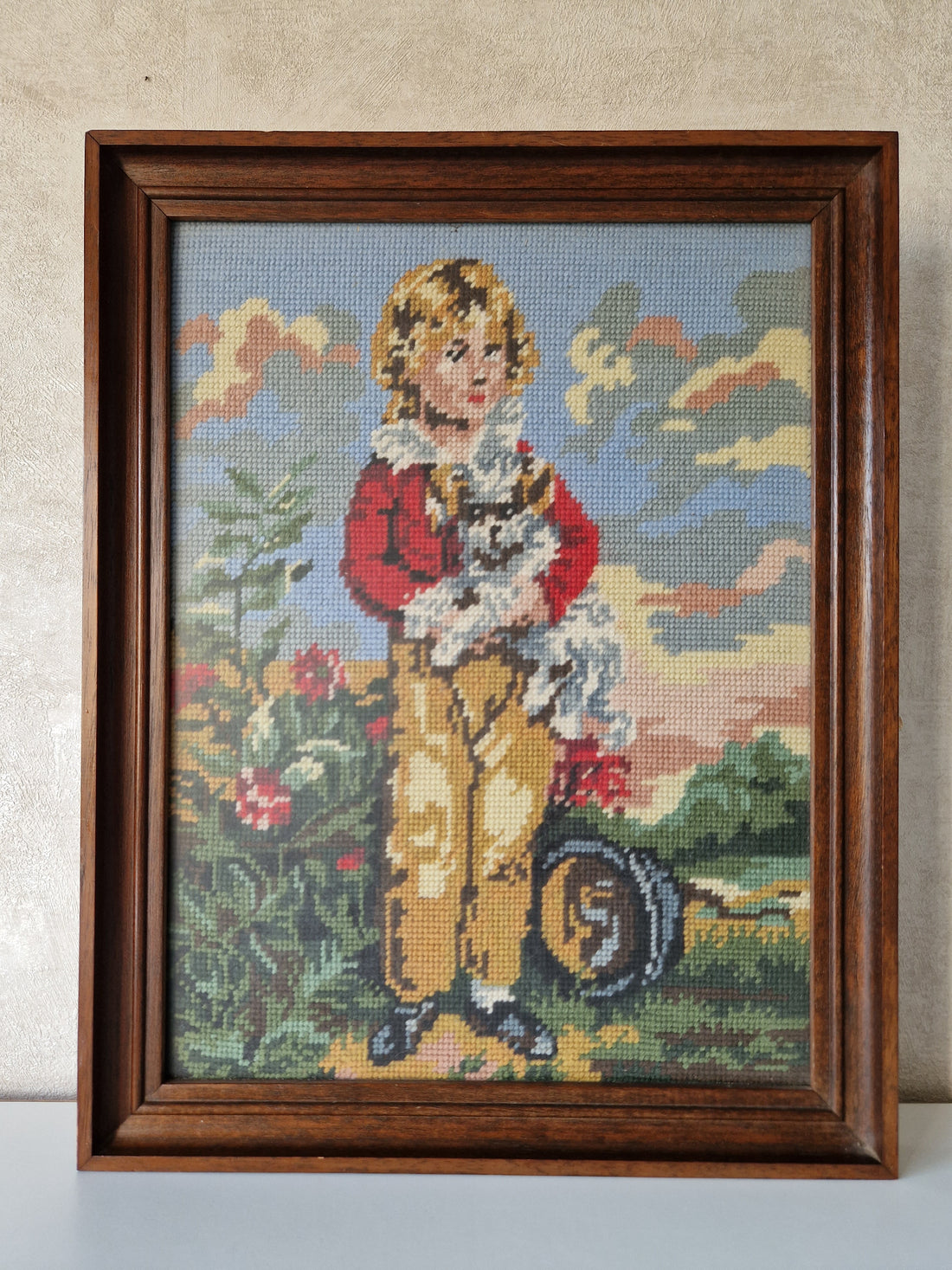 Ingelijst borduurwerk "jongen met hond"