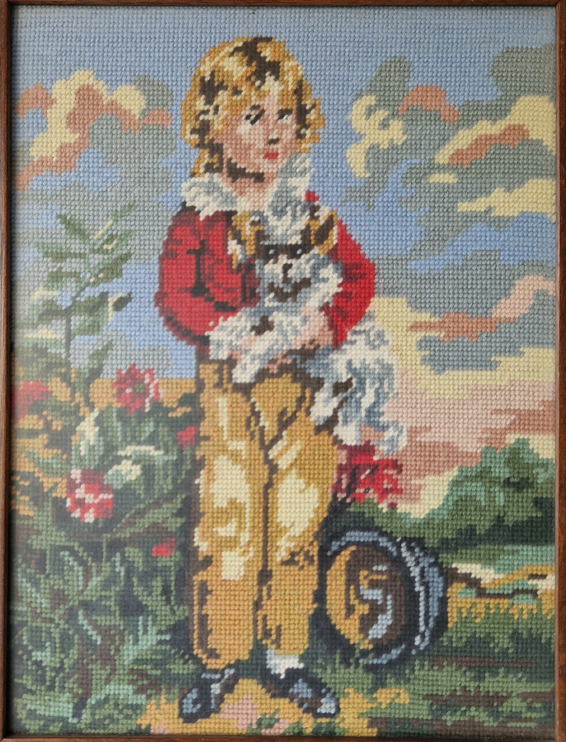 Ingelijst borduurwerk "jongen met hond"