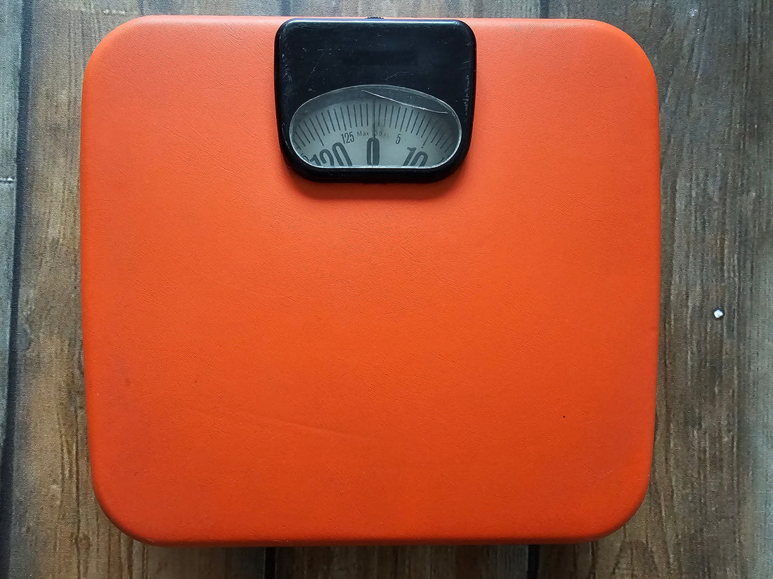Oranje personen weegschaal