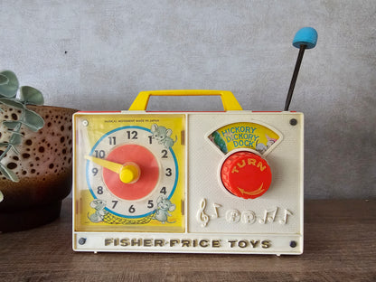 Fisher price vintage muziekdoosje met klok