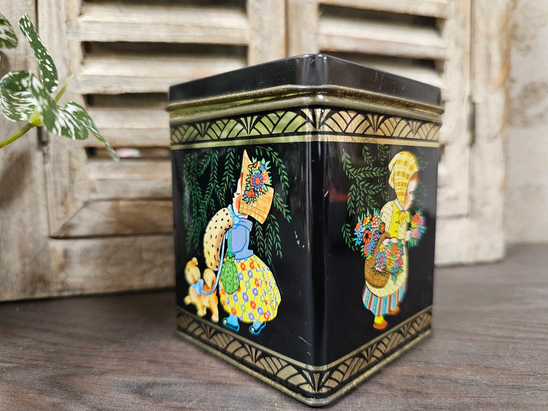 Vintage zwart blikje met meisje