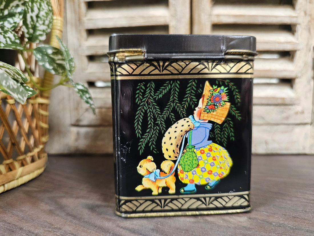 Vintage zwart blikje met meisje