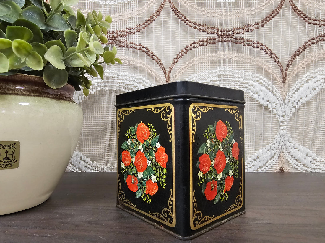 Zwart vintage blik met rode rozen