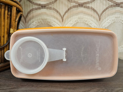 Tupperware oranje voorraadbus