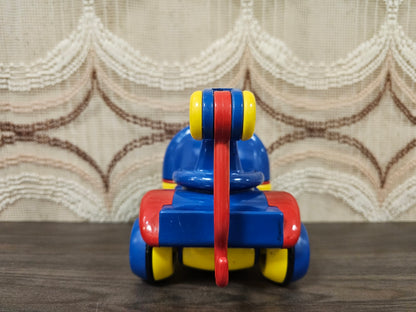 Vintage Ambi Toys takelwagen rood/blauw/geel met haak