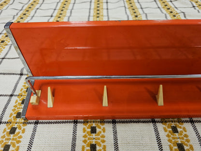 Brabantia planchet oranje metaal jaren 70 wandrek