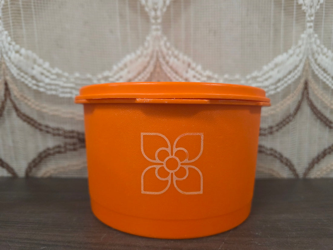 Tupperware oranje voorraadbus met bloemmotief 9 x 14