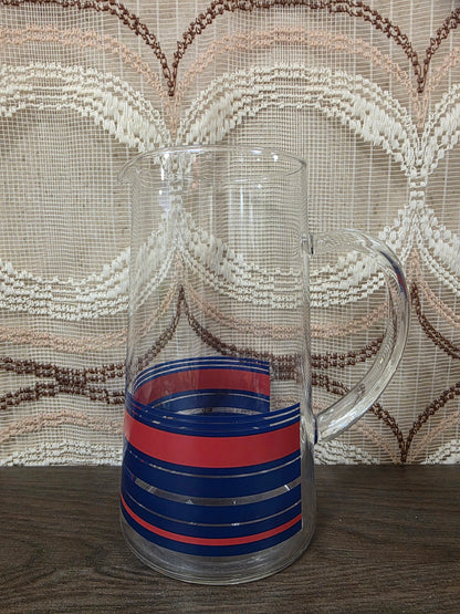 Vintage glazen karaf met rode en blauwe strepen
