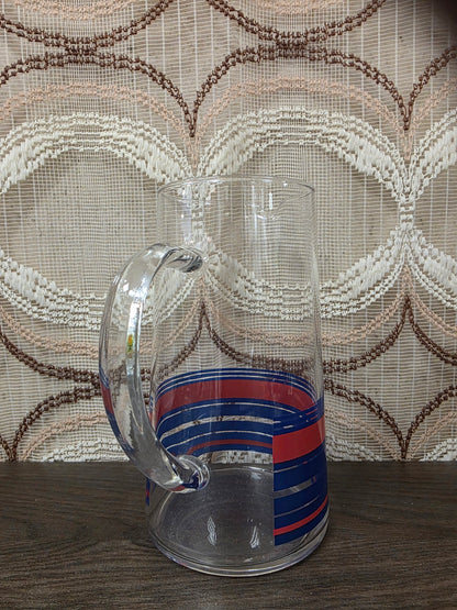 Vintage glazen karaf met rode en blauwe strepen