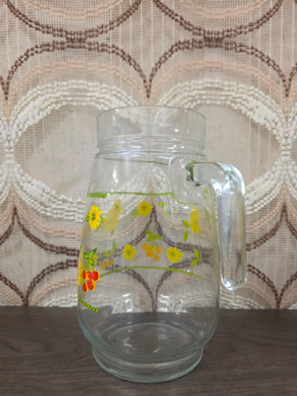 Vintage glazen karaf met gele bloemen