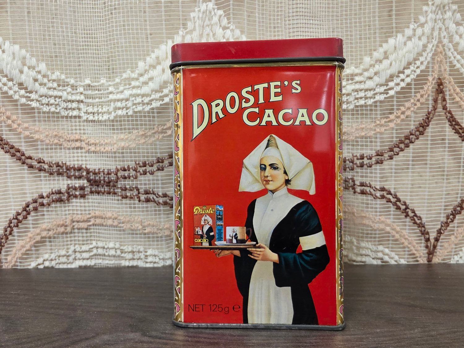 Vintage Droste cacao blik met vier verschillende afbeeldingen