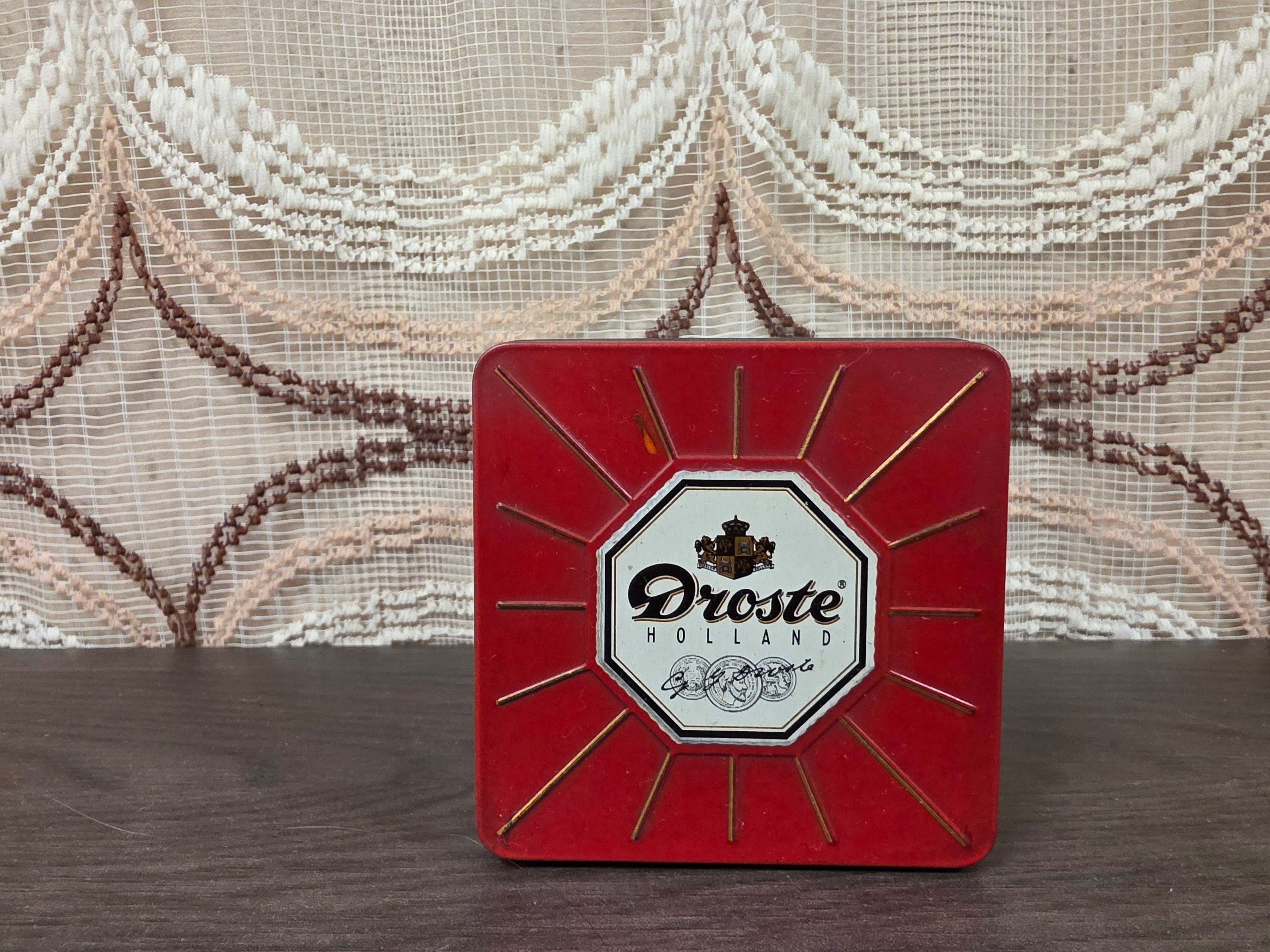 Vintage Droste cacao blik met vier verschillende afbeeldingen