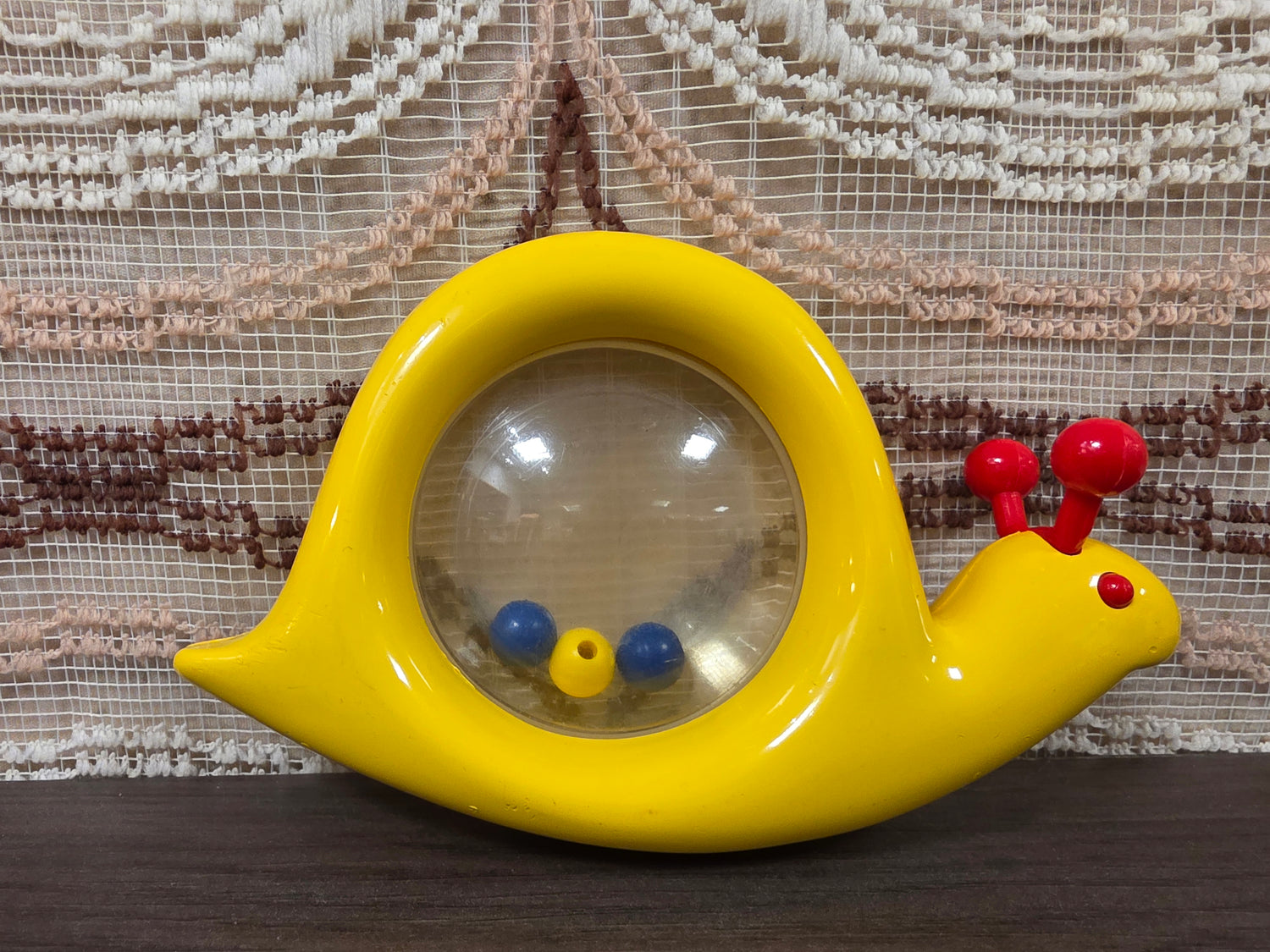 Ambi Toys Snail Rattle – gele slak