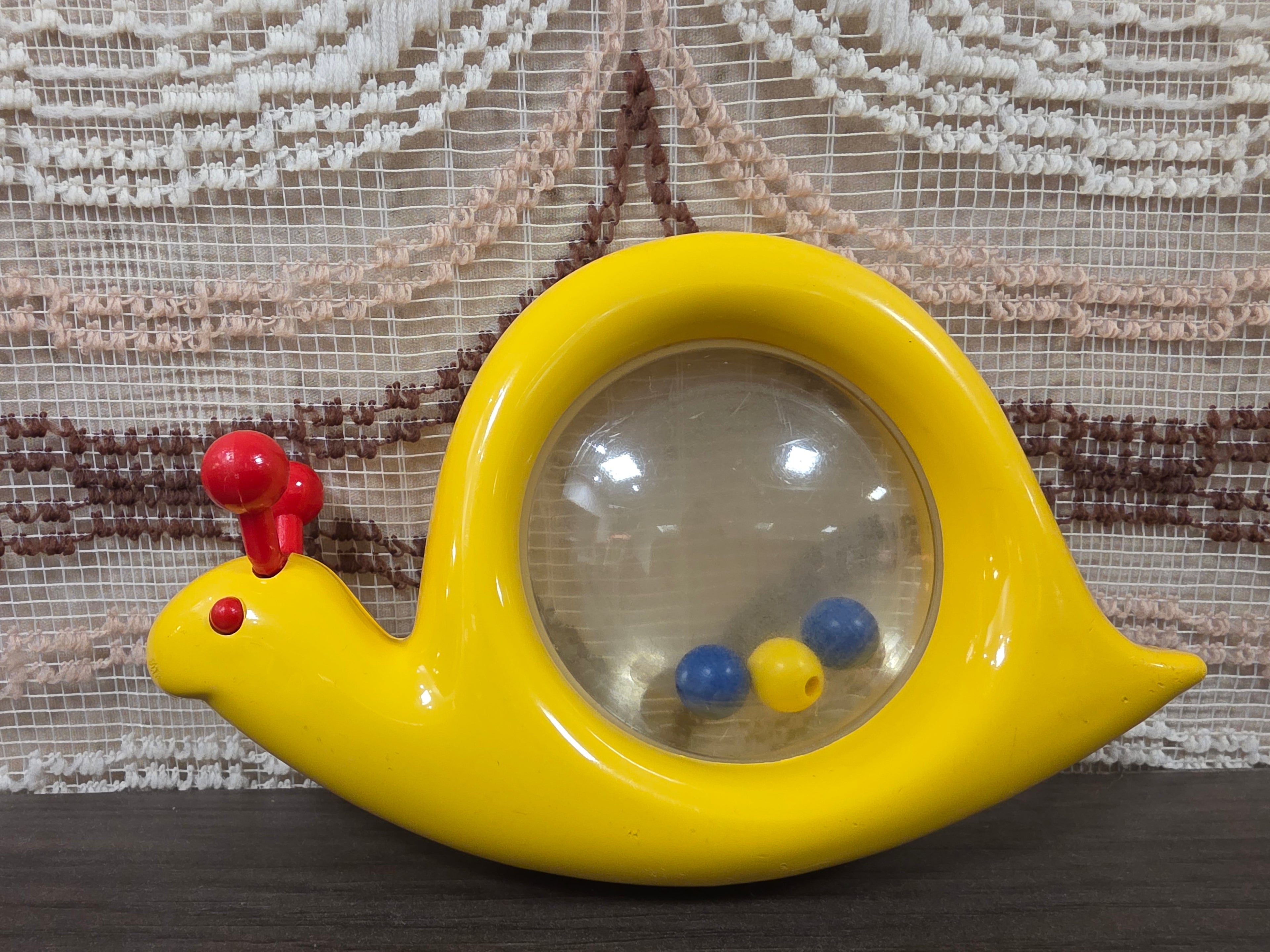 Ambi Toys Snail Rattle – gele slak