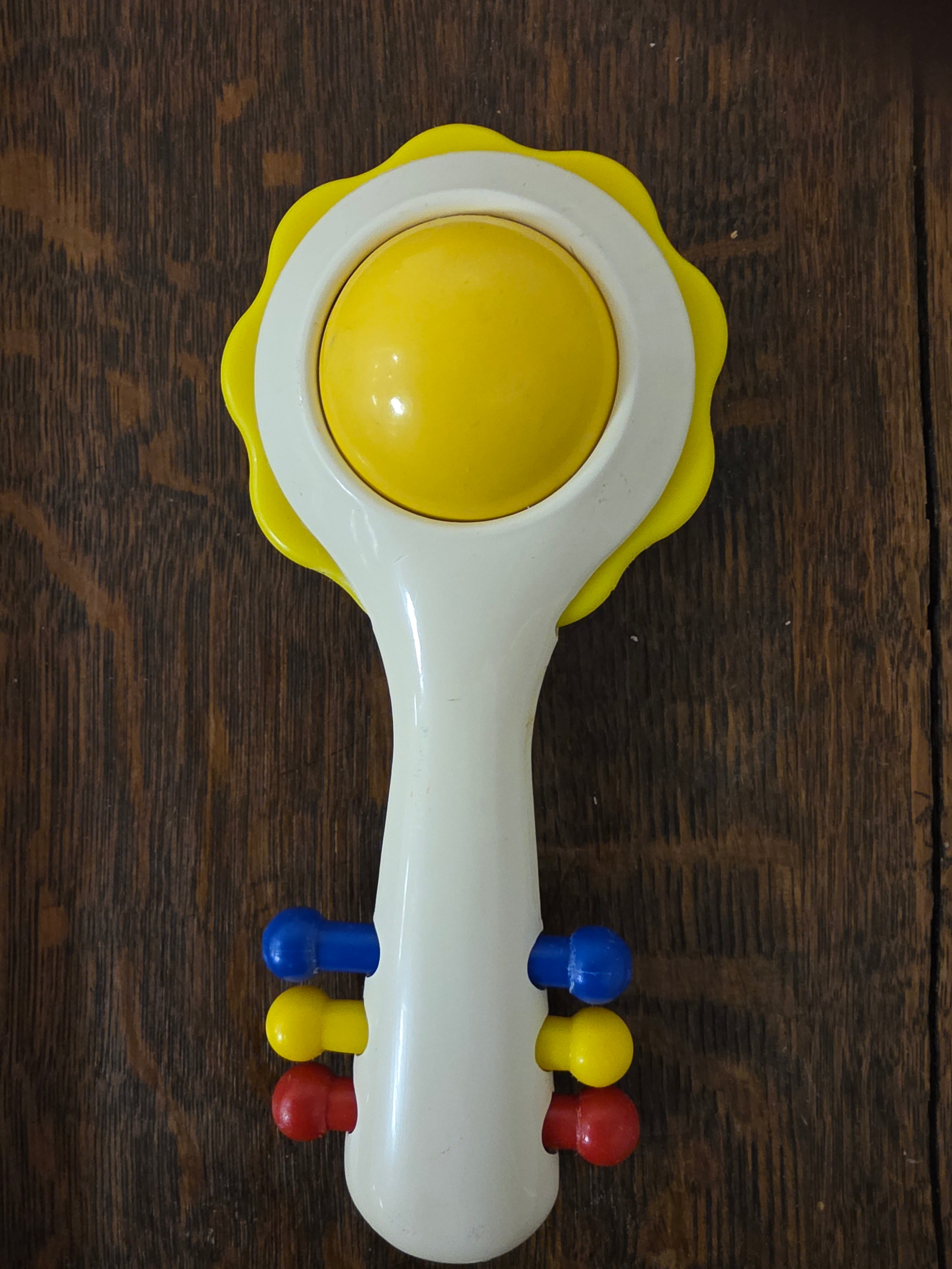 Ambi Toys Handy Dandy rammelaar gele rand