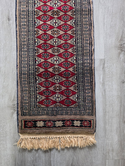 Vintage tafelloper rood met geometrisch patroon en franjes