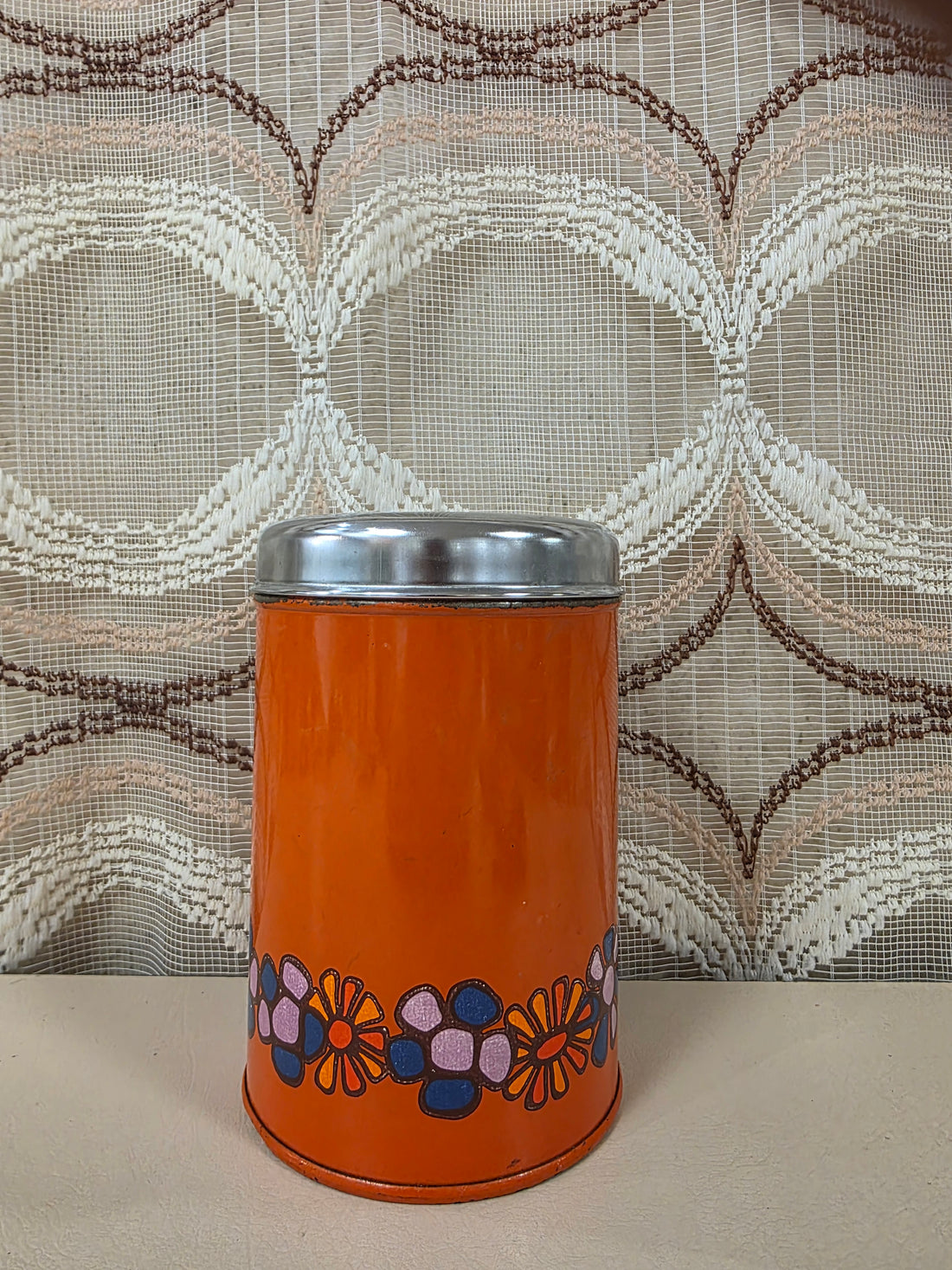 Vintage Brabantia Diane blik in oranje met bloemenmotief