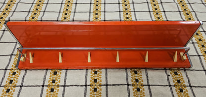 Oranje metalen Brabantia planchet met haakjes en chroomstang vintage jaren 70