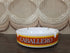Vintage glazen Caballero asbak met oranje en gele band