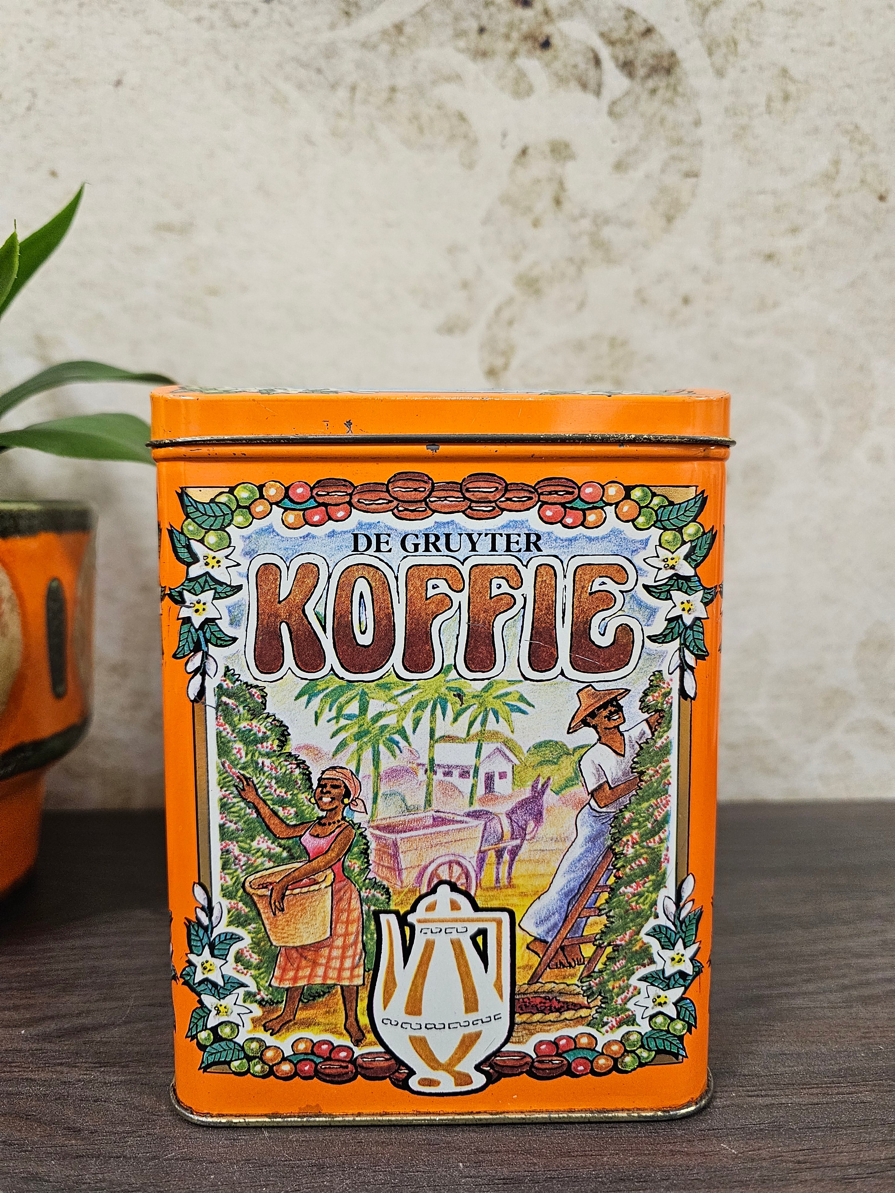 Vintage koffieblik De Gruyter oranje met nostalgische plaatjes