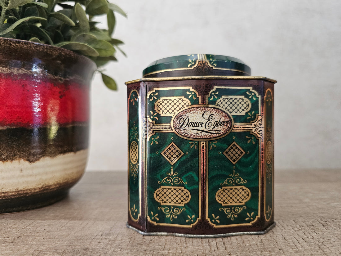 Vintage blik van Douwe Egberts Pickwick thee groen met goud.