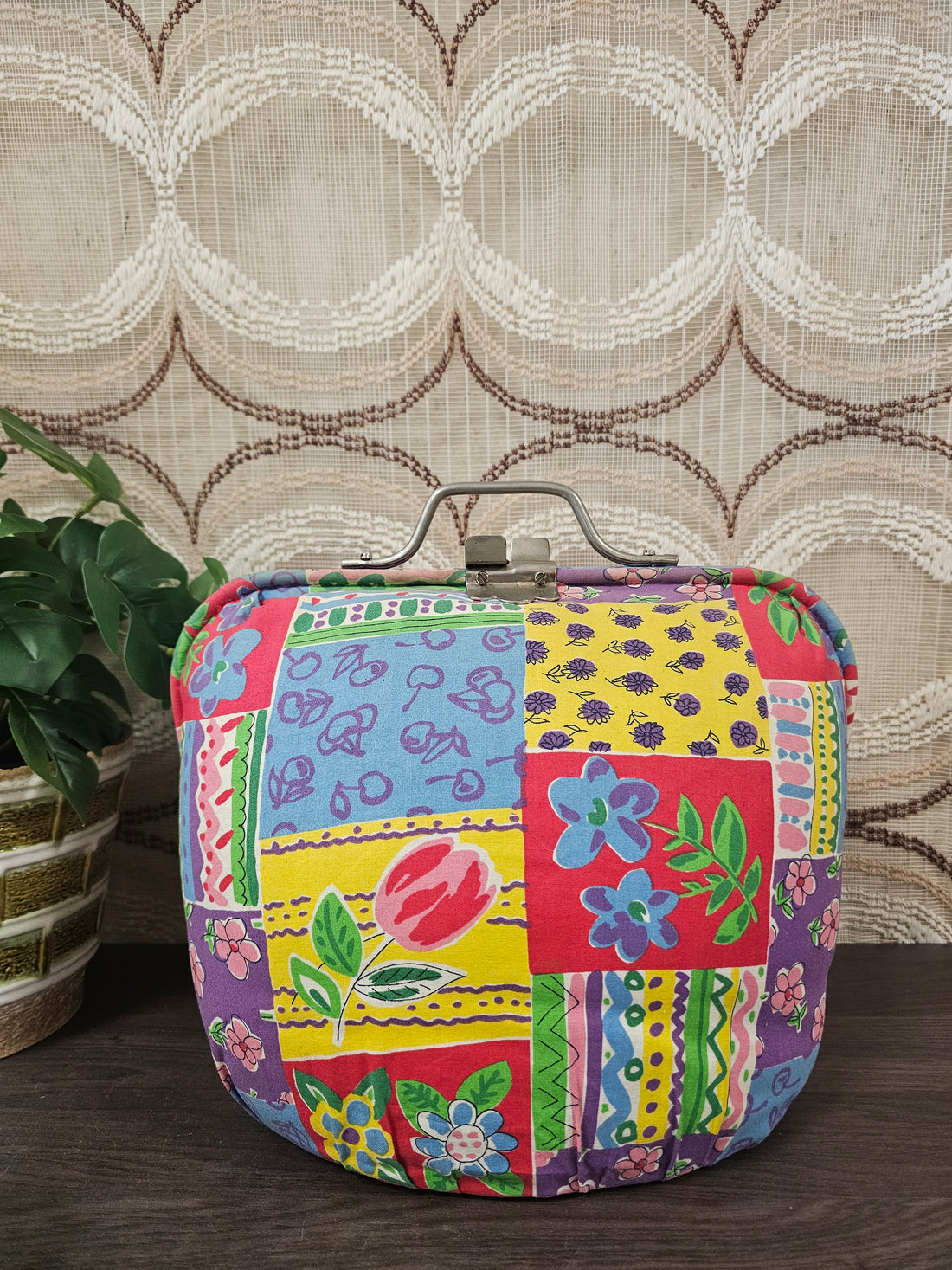 Vintage Douwe Egberts theebeurs met knip en kleurrijk bloemenpatroon