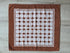 Vintage Elias katoenen handdoek in bruintinten met ingeweven geometrisch patroon.