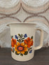 Vintage Emsa maatbeker met oranje gele bloemenprint jaren 70