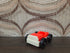 Vintage Fisher-Price autootje in rood wit met zwarte wielen.