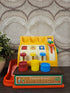 Vintage Fisher Price cash register met gekleurde muntjes uit de jaren 70
