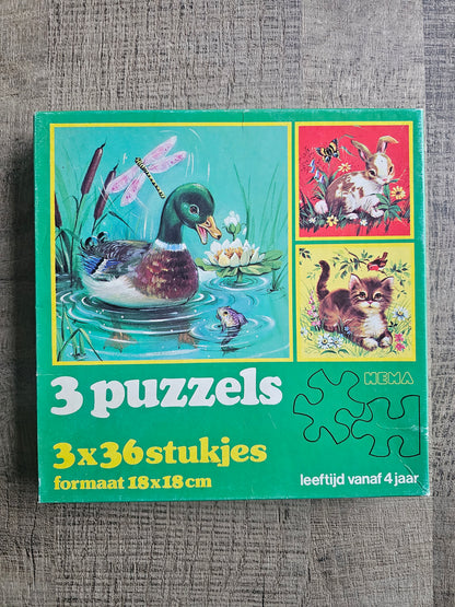 Hema vintage puzzeldoos met drie puzzels van 36 stukjes, groene doos
