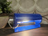 Ikea LOD V413 wandlamp in blauw met draaibare metalen kap