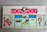 Vintage Amerikaanse Monopoly van Parker Brothers met compleet speelbord, pionnen, speelgeld en eigendomskaarten.