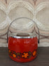 Vintage oranje ijsemmer met bloemendecor, metalen hengsel en houten knop