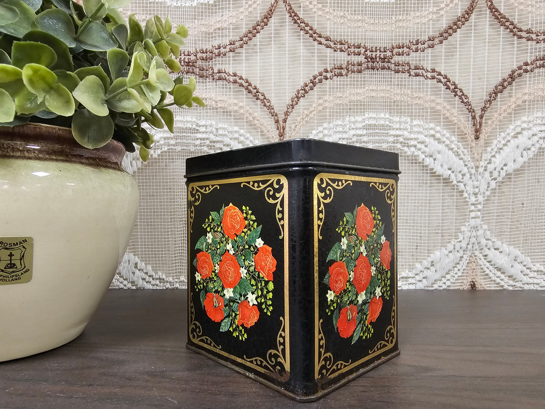 Zwart vintage blik met rode rozen