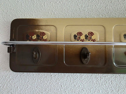 Linkerzijde Brabantia handdoekenrek met bloemmotief en zichtbare krasjes