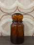 Ronde bruine glazen apothekerspot met bolle stop, circa 19 cm hoog